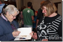 Janet gets her copy of Beths book autographed
