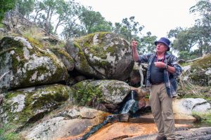 Neil Phillips explaining the Wallaby Gulley Nature Reserveformation of granite boulders at the
